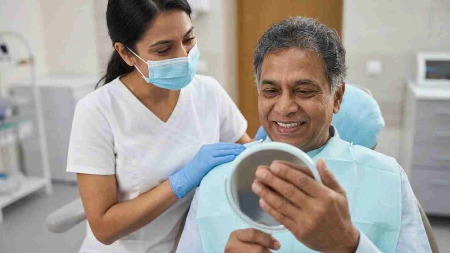 Patient reviewing smile after dental implant surgery during follow-up appointment to assess healing, recovery, and long-term implant success